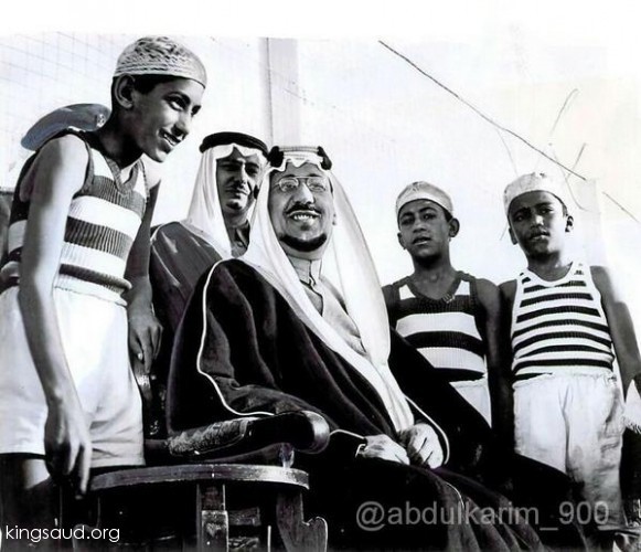 King Saud watching his sons Prince Sulran and Prince Majed playing Basketball, seen behind is Prince Fahad bin Saud