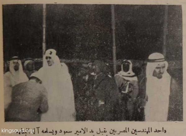 An Egyptian engineer hands over Crown Prince Saud the construction tool for the foundation stone for the expansion of the Grand Mosque in Medina - 1952