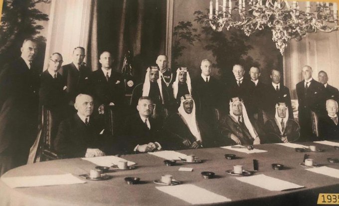 Crown Prince Saud visits the headquarters of the first bank in the Netherlands where the Saudi currency was printed, along with Fuad Hamza and Dr. Midhat Sheikh Al - Ard, and his two guards: Abdul Aziz Al - Rifai, and Saleh Ali Al - Salem .. God bless them / 1935.