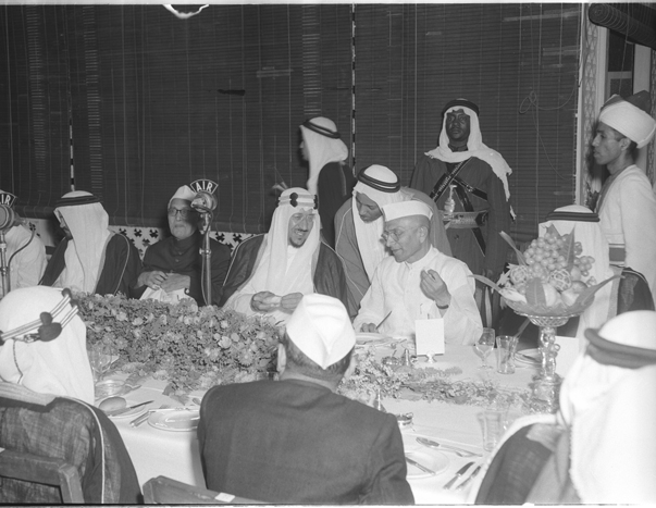  December 8, 1955. The visit of King Saud of Saudi Arabia to India. At the Banquet held in his honour at Raj Bhavan, Bombay. (R to L) Shri Morarji Desai, Chief Minister of Bombay, H.M. The King, and Dr. Sayed Mahmud, Dpty Minister for External Affairs