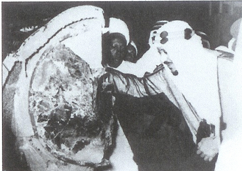 King Saud laying the Black Stone after replacing the old silver ring - 1956