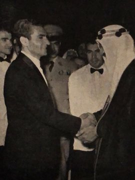 King Saud shakes hands with the Shah of Iran, Mohammad Reza Pahlavi. During his visit to Iran in 1955