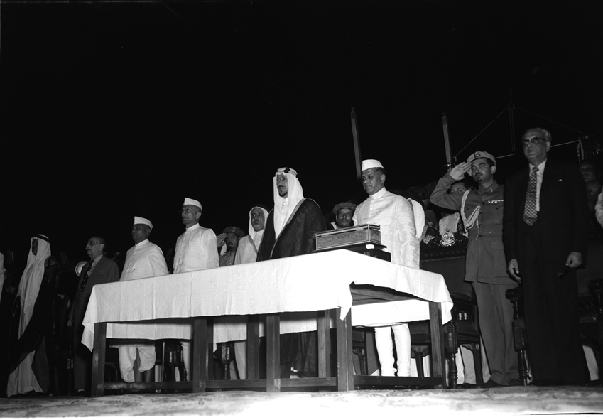  December 12 1955. The visit of King Saud of Saudi Arabia to India. A reception accorded to the King by the Bombay Municipalilty in Bombay. Standing L to R is Shri N.C. Pupala, Mayor of Bombay; H.M. The King; Shri Morarji Desai, Chief Minister of Bombay