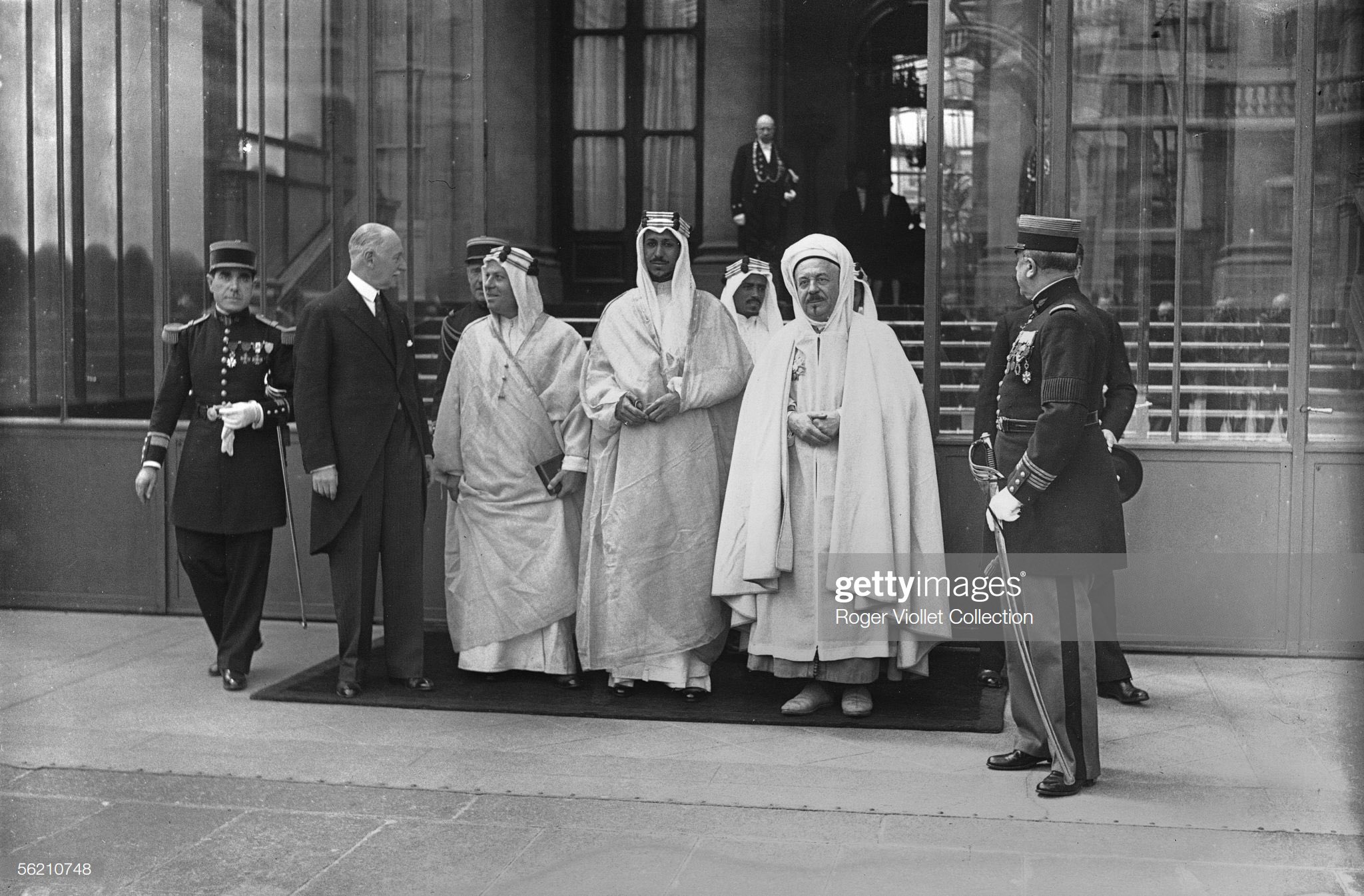 Crown prince Saud /king Saud ,in 1935, at the Elysee Palace. On the left : Andre de Fouquieres; on the right : Si Kaddour Ben Ghabrit, plenipotentiary minister of Morocco, as interpreter. Paris, 1935.