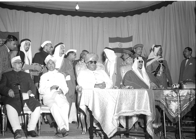 December 12, 1955. The visit of King Saud to India. President City Municipal Council presenting an address of welcome to King Saud at a reception in Mysore. H.H. the Rajpramukh & Shri K. Hanumanthaiya, Chief Minister of Mysore are also there
