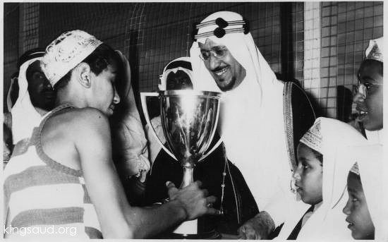King Saud with his son Khaled after winning a tournament