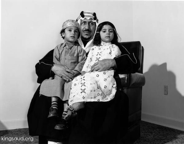 King Saud holding his daughter Princess Nouf and his son Prince Mansour.