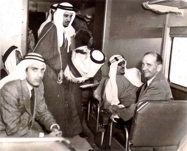 Crown Prince Saud with King Abdulaziz, may God have mercy on them, around 1953, Prince Talal appears in the back