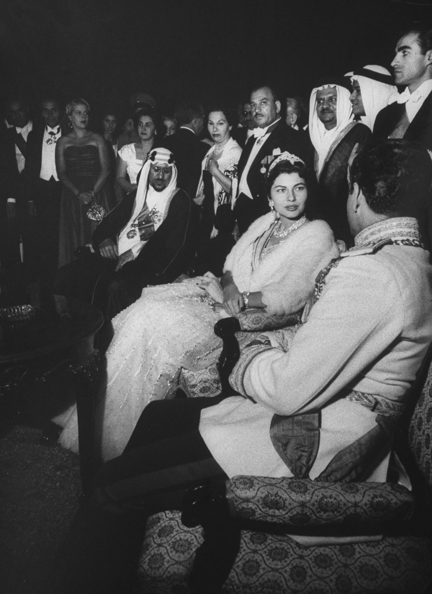 Mohamed Reza (R seated) sitting next to his wife at the garden party honoring King Saud Ibn Abdul Aziz's (3rd R) during his visit. (Photo by James WhitmoreTime Life PicturesGettyimages)