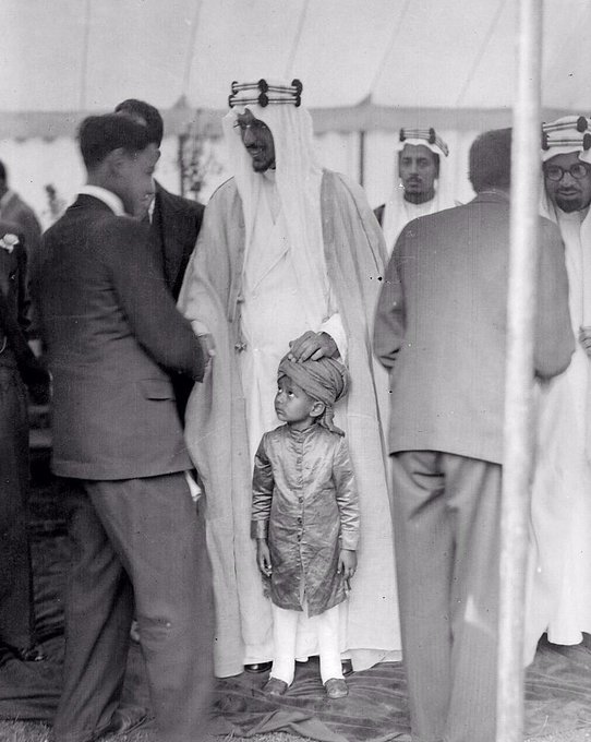 Crown Prince Saud—later King Saud—at the inauguration of Shah Jahan Mosque in London, with Sheikh Hafiz Wahba standing behind him, in 1935.