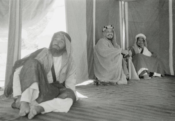 Abdullah Philby, Faisal bin Bandar Al‑Duwish, and the child Prince Fahd bin Saud, in one of the photographs taken by Abdullah Philby in Crown Prince Saud’s tent in Mina on 3‑6‑1936.