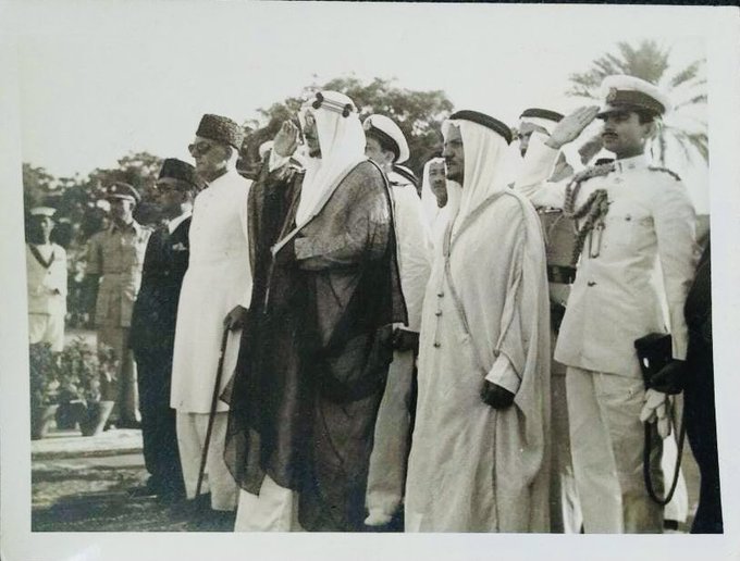 King Saud returned the salute after the greeting, and to his right stood Sheikh Abdullah BalKhair and His Excellency Mr. Mohammad Ali, the Prime Minister of Pakistan.
