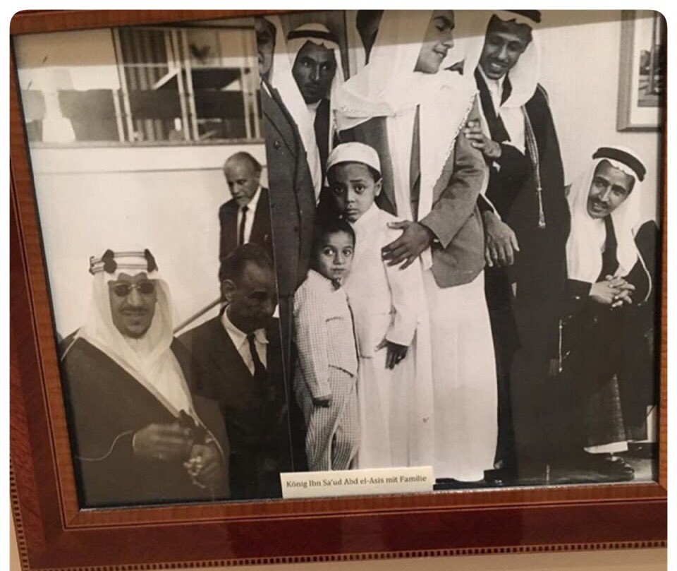 King Saud—may God have mercy upon him—during his visit to Germany, accompanied by his sons Princes Mishhur, Shuqran, and Nawwaf, may God have mercy upon them. The photographs are displayed at the Colombi Hotel in Freiburg, Germany