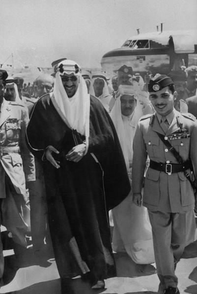 King Saud upon arrival at the airport in Jordan and a meeting with King Hussein Ibn Talal