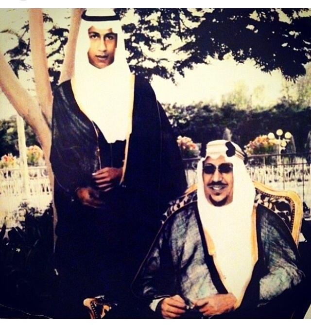 King Saud — may God have mercy on him — with his son Prince Majid at his palace in Al‑Nasiriyah, Riyadh.