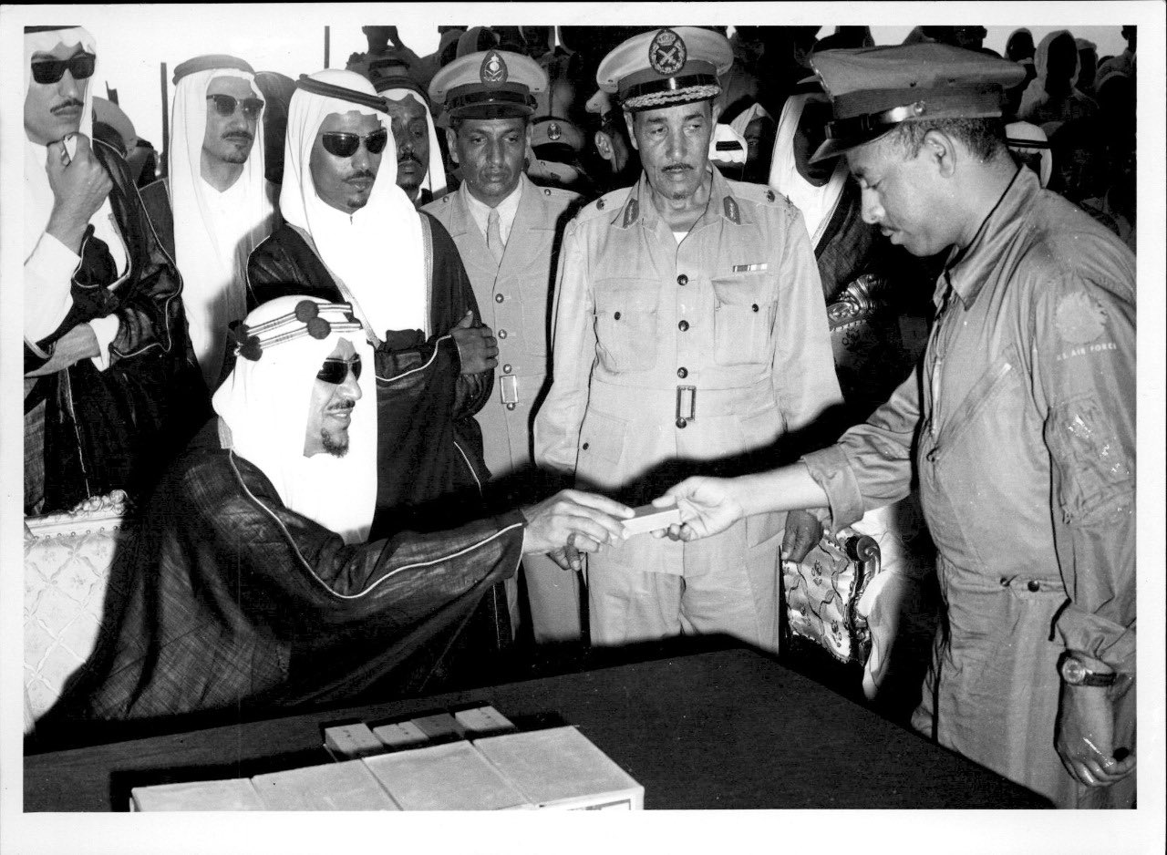 King Saud, surrounded by several Saudi officers, with behind him his sons Princes Abdullah and Khalid — may God have mercy on them.