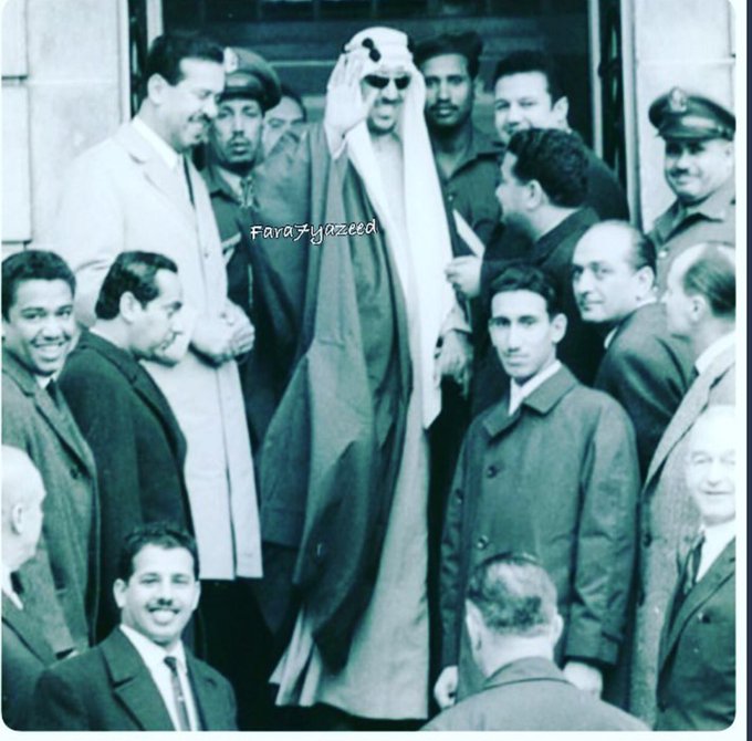 King Saud surrounded by Prince Faisal bin Turki and his sons Princes Fahd, Sultan, Mansour, and Mishʿal, along with Colonel ʿAli bin Radʿān, in France in 1963.