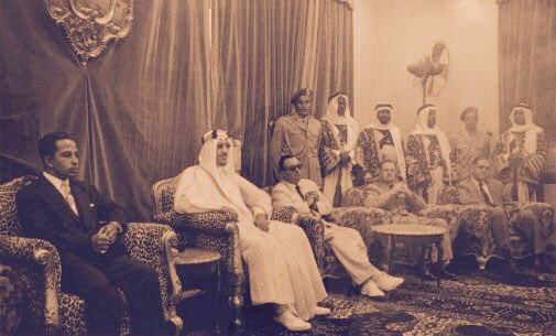 King Saud—may God have mercy on him—with King Faisal II of Iraq, together with the President and senior officials of ARAMCO, in Dhahran in 1957.