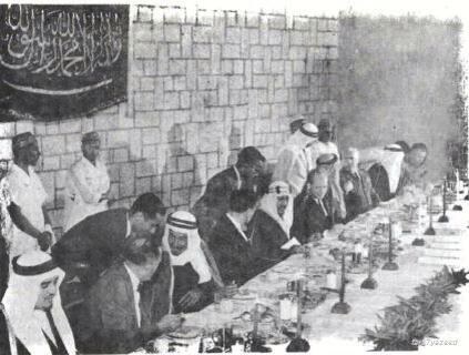King Saud—may God have mercy on him—together with Prince Mohammed bin Saud al‑Kabir, Prince Fahd bin Abdulaziz, and ARAMCO personnel in Dhahran.