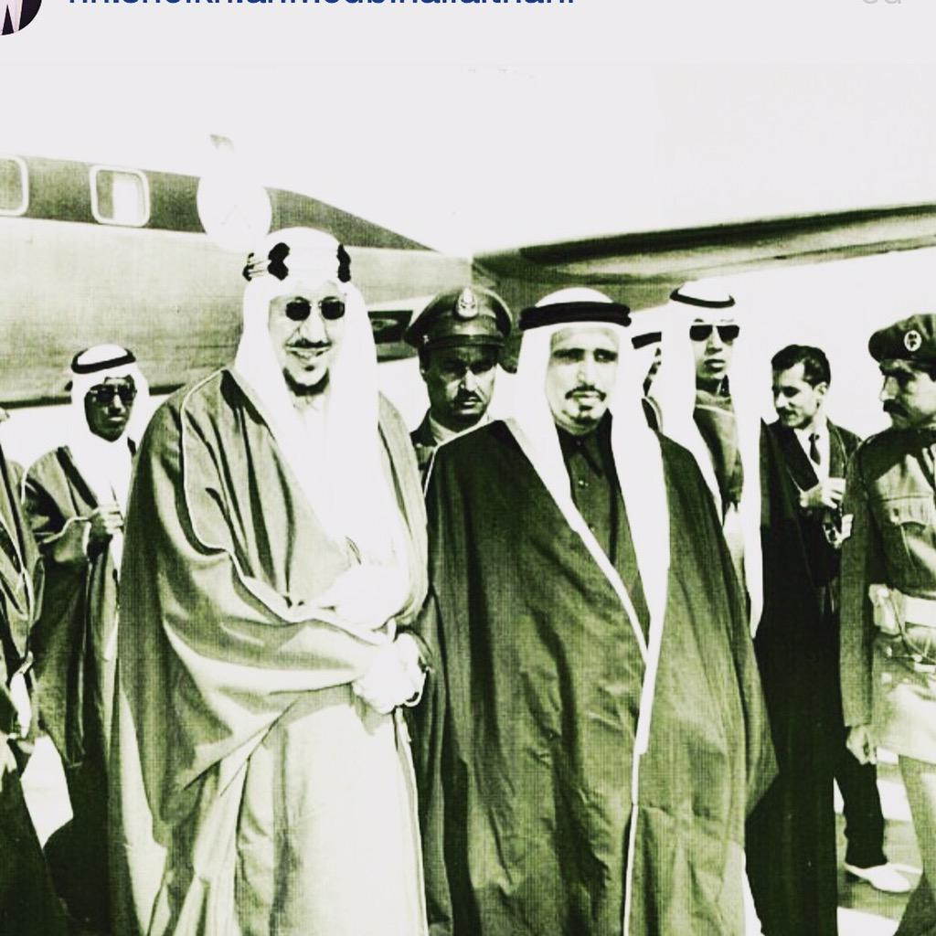 King Saud with the Amir of Qatar, Sheikh Ahmed bin Ali bin Abdullah Al Thani, at Doha Airport, accompanied by Princes Majid bin Saud and Thamir bin Saud.