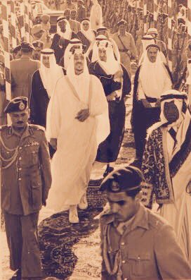 King Saud, accompanied by Crown Prince Faisal, Prince Saad bin Saud, Mohammed al‑Dughaythir, Bakr Younis, and Saeed Joudat, during an inspection of the Holy Mosque expansion works.