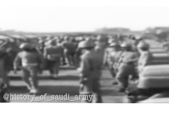 Saudi Army personnel preparing to perform a military display before King Saud—may God have mercy on him.