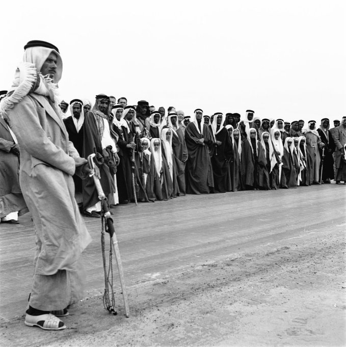 A beautiful photograph of several sons of King Saud—may God have mercy on him—waiting for his arrival in Dhahran during King Saud’s visit to the Eastern Province in 1954. Photographed by the Italian photographer Ilo Battigelli. Source: Pitt Rivers Museum – “Memory of the East” Collection