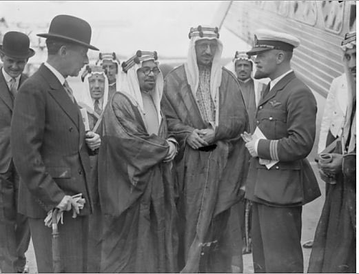 During Crown Prince Saud’s (later King Saud) first visit to Britain in 1935, he visited Croydon Aerodrome, where he spoke with Captain Jonas, the pilot who had flown him to London. On the left appears Lieutenant Colonel Shelmerdine, Director‑General of Civil Aviation as of 21 June 1935. He was accompanied by Khairuddin Al‑Zarkali, Hafiz Wahba, Dr. Rifaat Sheikh Al‑Ard, and the royal escorts Abdulaziz Al‑Rifai and Saleh Al‑Ali Al‑Salem