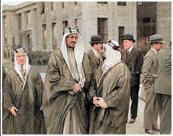 Crown Prince Saud bin Abdulaziz arriving in London to attend the coronation of King George VI, accompanied by Dr. Medhat Sheikh al‑Ard and Hafiz Wahba, in 1938.