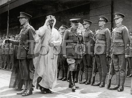 Crown Prince Saud receiving an official welcome in London in 1938 upon his arrival to attend the coronation ceremonies of King George VI.