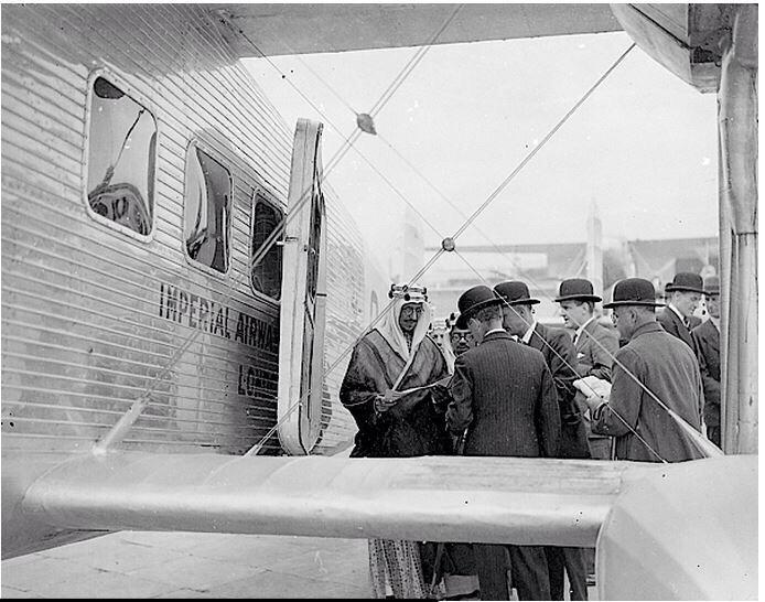 Crown Prince Saud—later King Saud—arriving in London, accompanied by Hafiz Wahba and Dr. Medhat Sheikh al‑Ard.