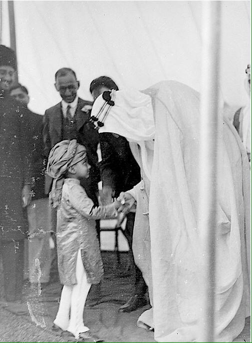Crown Prince Saud—later King Saud—arriving in London, accompanied by Hafiz Wahba and Dr. Medhat Sheikh al‑Ard.
