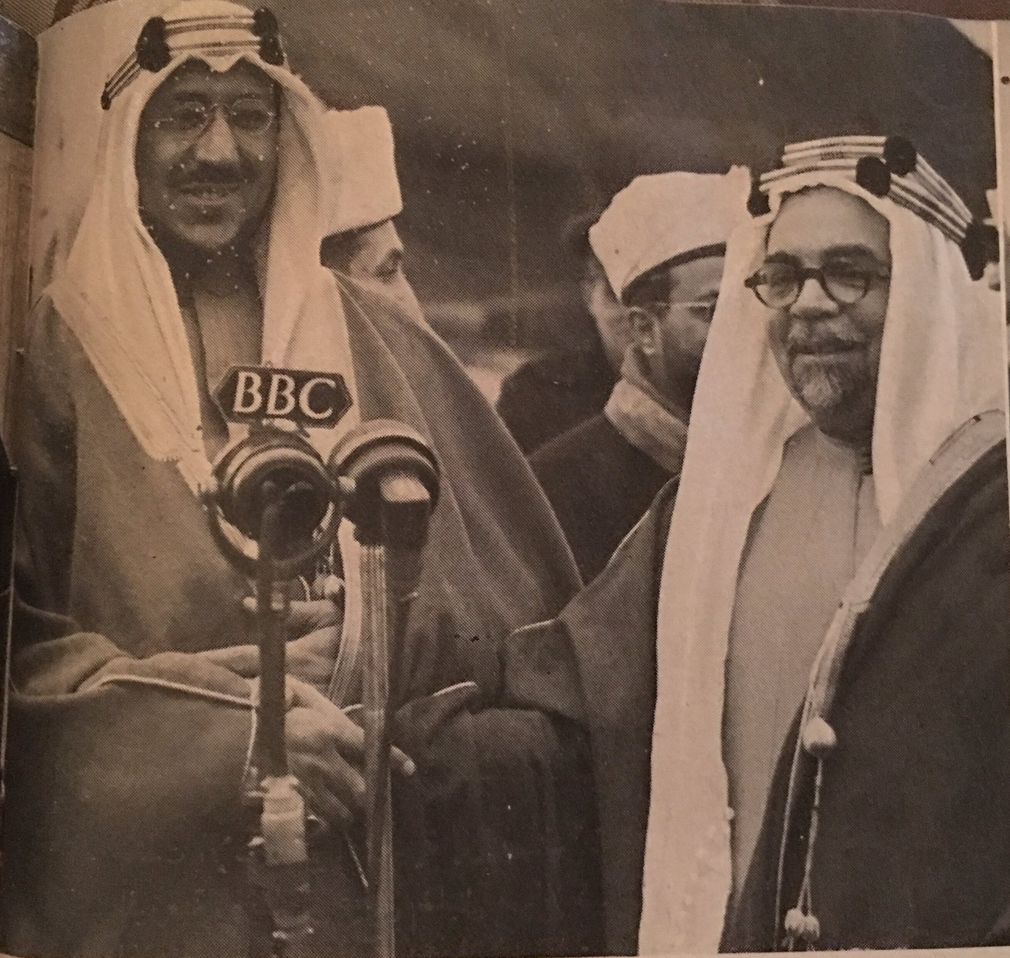 Crown Prince Saud speaking to the British Broadcasting Corporation (BBC) in London, accompanied by Hafiz Wahba, Sayf al‑Islam ʿAbdullah, and Anthony Eden, in 1948.