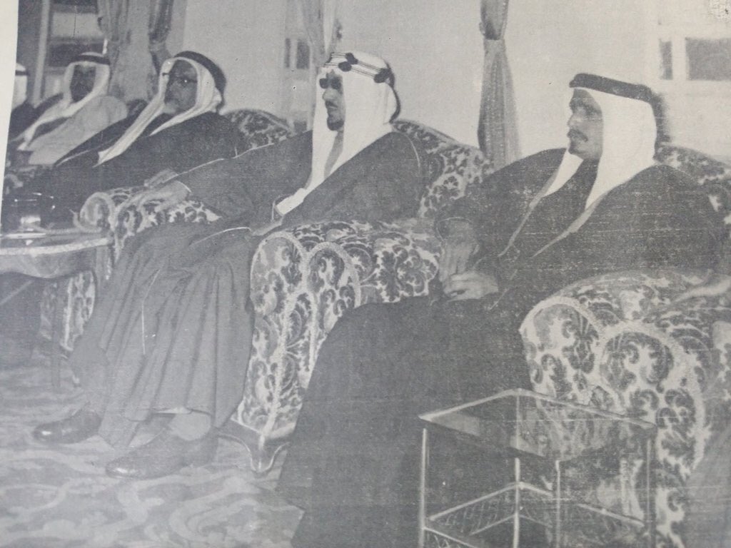 King Saud’s visit to Qatar, seated between Sheikh Ali and Sheikh Ahmed Al Thani — as documented in Al‑Nahda magazine, special issue No. 40 marking the anniversary of King Saud’s accession, 1382 AH.